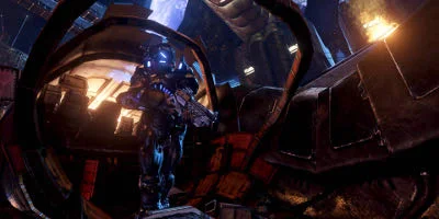 A friendly character, standing on top of some debris with his weapon