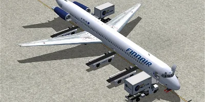 A Finnair MD-80 being loaded up on the ground, at an airport