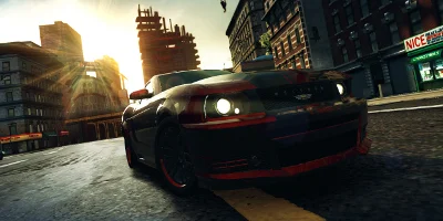 A red and black muscle car, speeding through the city