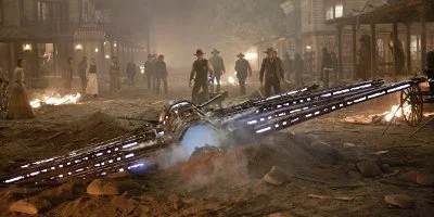 Cowboys kijken naar een neergestort ruimteschip