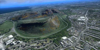 A very impressive-looking hill, over-looking a town/city